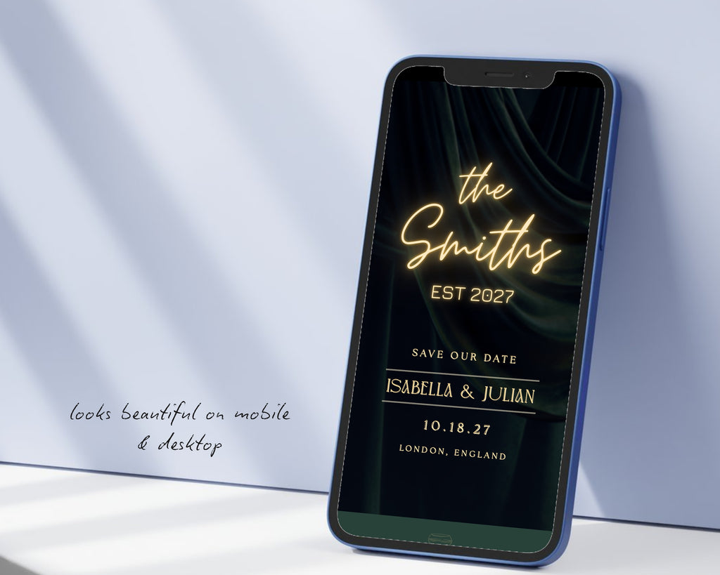 Art deco save the date website on a phone propped against a pale blue wall, showing the neon sign, the couple's names, wedding date and city.