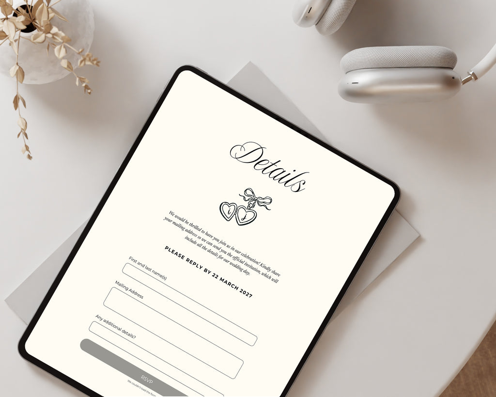 Art deco save the date details and RSVP page on a tablet in a flat lay with dried flowers and headphones.