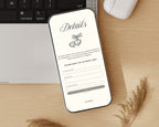 Art deco save the date details page on a phone beside a keyboard and pampas grass, showing the reply-by date and the guest address form.