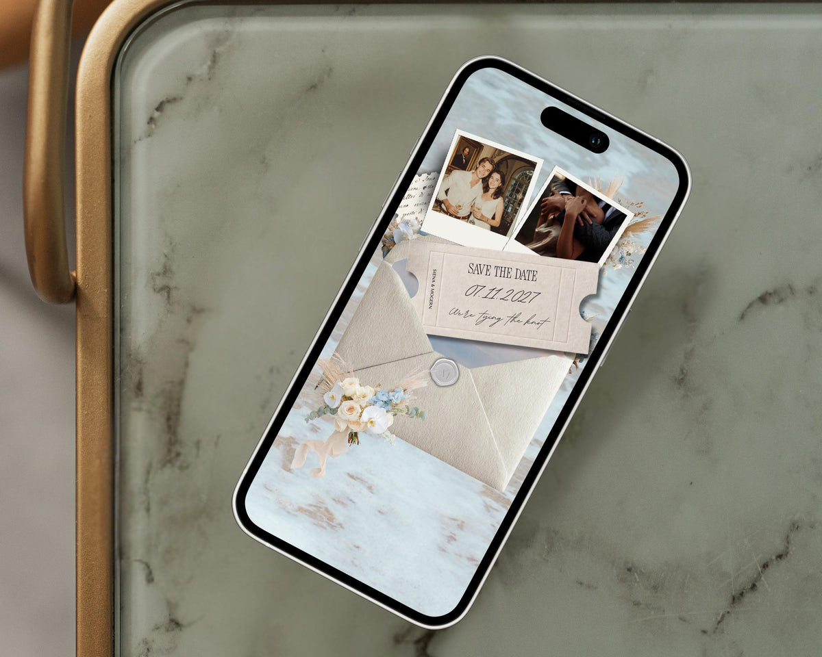 Coastal save the date website template displayed on a phone, styled on a marble tray.