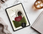Olive green classical save the date website template on a tablet in a styled flat-lay.