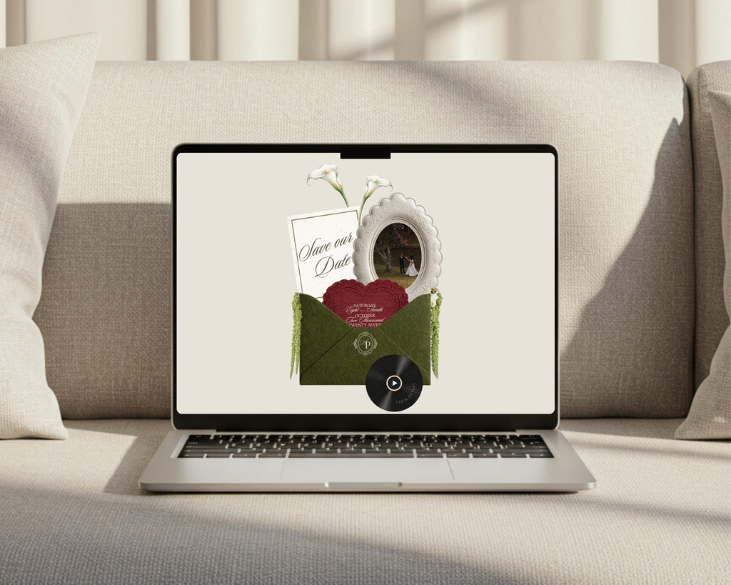 Olive green save the date website shown on a laptop, with the opened envelope invitation on screen.