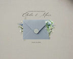 Dusty Blue French Toile wedding website — the animated envelope opening on a phone